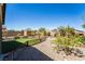 Beautiful backyard with a lawn area, rock landscaping and a shed for extra storage at 357 S Milan St, Henderson, NV 89015