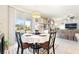 Bright dining area with patio access, neutral decor, and comfortable seating at 357 S Milan St, Henderson, NV 89015