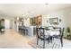 Open dining area with counter seating, pendant lights, and stainless steel appliances at 357 S Milan St, Henderson, NV 89015