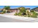 Charming home with a large 3-car garage, brick driveway, and tasteful landscaping at 357 S Milan St, Henderson, NV 89015