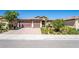 Charming single-story home featuring a well-manicured yard and a spacious three-car garage at 357 S Milan St, Henderson, NV 89015