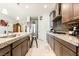 Spacious kitchen with stainless steel appliances, granite countertops, and tile flooring at 357 S Milan St, Henderson, NV 89015