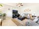 Comfortable living room featuring neutral paint, ceiling fan, and plush seating at 357 S Milan St, Henderson, NV 89015