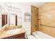 This well-lit bathroom is nicely upgraded with a granite countertop and tiled bath/shower at 3668 Villa Knolls East Dr, Las Vegas, NV 89120