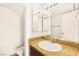 Bathroom featuring a sink with granite countertop and a mirrored medicine cabinet at 3668 Villa Knolls East Dr, Las Vegas, NV 89120