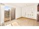 Bright dining room with tile flooring, sliding glass door, and decorative mirrors at 3668 Villa Knolls East Dr, Las Vegas, NV 89120