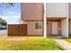 Charming townhome exterior with lawn and a private wooden fence at 3668 Villa Knolls East Dr, Las Vegas, NV 89120