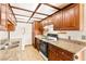 Well-equipped kitchen featuring granite countertops, cabinetry, and standard appliances at 3668 Villa Knolls East Dr, Las Vegas, NV 89120