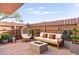 Relaxing patio area with comfortable seating, modern fire pit, and decorative plants at 3668 Villa Knolls East Dr, Las Vegas, NV 89120