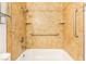This well-lit shower is nicely upgraded with tile and shower caddy at 3668 Villa Knolls East Dr, Las Vegas, NV 89120