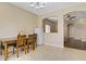 Bright dining room featuring tile floors, neutral paint, and access to an open living space at 4020 Smokey Fog Ave # 3, North Las Vegas, NV 89081