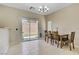 Bright dining room featuring a dining table, tile floors and a glass patio door at 4020 Smokey Fog Ave # 3, North Las Vegas, NV 89081
