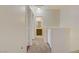 Upstairs hallway featuring neutral walls and carpet leading to bedrooms and bathrooms at 4020 Smokey Fog Ave # 3, North Las Vegas, NV 89081