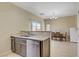 Bright kitchen features updated cabinets, stainless steel dishwasher and eat-in dining area at 4020 Smokey Fog Ave # 3, North Las Vegas, NV 89081