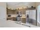 Updated kitchen features stainless steel appliances, tile backsplash and ample counter space at 4020 Smokey Fog Ave # 3, North Las Vegas, NV 89081