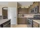 Updated kitchen boasts stainless steel appliances, decorative backsplash and ample countertop space at 4020 Smokey Fog Ave # 3, North Las Vegas, NV 89081