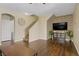 Open living room featuring wood floors, a staircase, and neutral walls with a contemporary design at 4020 Smokey Fog Ave # 3, North Las Vegas, NV 89081