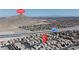 Aerial view showcasing neighborhood with nearby Lone Mountain and the 215 freeway at 4435 Peaceful Harbor St, Las Vegas, NV 89129