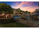 Backyard with a refreshing pool, patio, charming trees, and inviting outdoor space at 4435 Peaceful Harbor St, Las Vegas, NV 89129