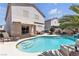 Home exterior boasting a pool, patio seating, and a well-maintained backyard at 4435 Peaceful Harbor St, Las Vegas, NV 89129