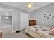 Comfortable bedroom features neutral walls, carpet flooring, closet and window overlooking a dark brown dresser at 4435 Peaceful Harbor St, Las Vegas, NV 89129