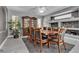 Formal dining room featuring an oversized wood table and eight chairs at 4435 Peaceful Harbor St, Las Vegas, NV 89129