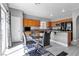 Bright kitchen features wood cabinetry, granite countertops, and stainless steel appliances at 4435 Peaceful Harbor St, Las Vegas, NV 89129