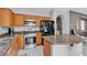 Modern kitchen with stainless steel appliances, granite countertops, and custom wood cabinetry at 4435 Peaceful Harbor St, Las Vegas, NV 89129