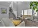 Bright, spacious living room with comfortable seating, a staircase and neutral decor at 4435 Peaceful Harbor St, Las Vegas, NV 89129