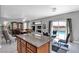 Open concept living area with access to pool and backyard through sliding glass doors at 4435 Peaceful Harbor St, Las Vegas, NV 89129
