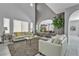 Spacious living room with soaring ceilings, bright windows, and stylish neutral decor at 4435 Peaceful Harbor St, Las Vegas, NV 89129