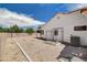 Backyard with gravel landscaping, a covered patio, and a fenced area for pets at 4612 Standing Bluff Way, Las Vegas, NV 89130