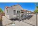 Enclosed backyard features a covered patio, rock landscaping, and defined perimeter fencing at 4612 Standing Bluff Way, Las Vegas, NV 89130