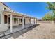 Covered patio overlooks the spacious backyard area, with neutral rock landscaping at 4612 Standing Bluff Way, Las Vegas, NV 89130