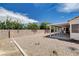 Spacious backyard features rock landscaping, privacy walls, and covered patio at 4612 Standing Bluff Way, Las Vegas, NV 89130