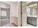 The bathroom includes a shower, toilet, sink, and large mirror; connected to the bedroom at 4612 Standing Bluff Way, Las Vegas, NV 89130