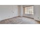 This carpeted bedroom features a bright window offering natural light and a closet door at 4612 Standing Bluff Way, Las Vegas, NV 89130
