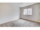 This carpeted bedroom has a large window to provide natural light and a closet at 4612 Standing Bluff Way, Las Vegas, NV 89130