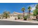 Single-story home featuring a tile roof, desert landscaping, and an attached three-car garage at 4612 Standing Bluff Way, Las Vegas, NV 89130
