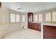 Kitchen nook featuring tile flooring, wood cabinets and bright natural light at 4612 Standing Bluff Way, Las Vegas, NV 89130