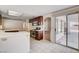 Bright kitchen features tile floors, wood cabinets, and access to the backyard at 4612 Standing Bluff Way, Las Vegas, NV 89130