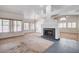 Bright living room with fireplace, large windows offering ample natural light at 4612 Standing Bluff Way, Las Vegas, NV 89130