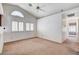 Bright and airy living room featuring a vaulted ceiling and large windows at 4612 Standing Bluff Way, Las Vegas, NV 89130