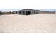 Expansive backyard showcasing a modern home with a covered patio and ample space for landscaping at 4630 Blushing Dawn Ave, Las Vegas, NV 89118