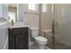 Modern bathroom features a vanity, toilet, and glass-enclosed shower with a bench at 4630 Blushing Dawn Ave, Las Vegas, NV 89118