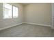 Neutral bedroom featuring a large window for natural light and plush carpeting at 4630 Blushing Dawn Ave, Las Vegas, NV 89118