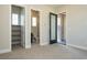 Bedroom view showcasing a walk-in closet, bathroom, and access to an outdoor patio at 4630 Blushing Dawn Ave, Las Vegas, NV 89118