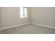 Bedroom with carpet floors, baseboards and a window at 4630 Blushing Dawn Ave, Las Vegas, NV 89118