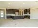 Spacious kitchen features a large center island, tile floors and stainless steel appliances at 4630 Blushing Dawn Ave, Las Vegas, NV 89118