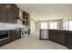 Well-equipped kitchen with stainless steel appliances, sleek dark cabinets, and open layout at 4630 Blushing Dawn Ave, Las Vegas, NV 89118